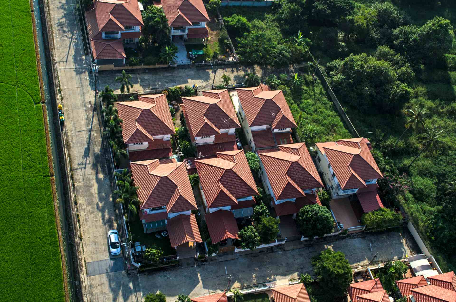 Red roofs in residential area housing, view from the air